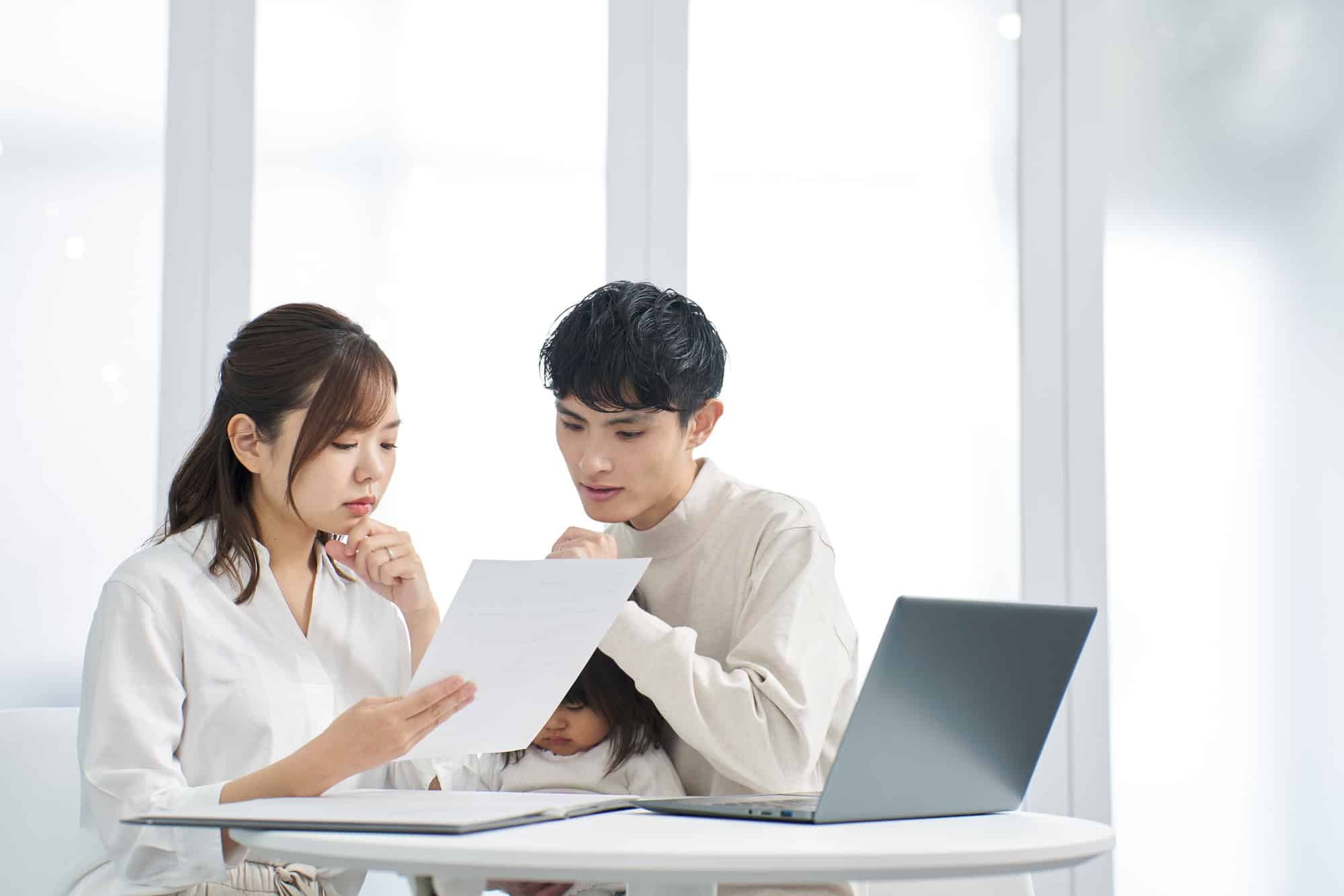 Asian family considering purchasing insurance