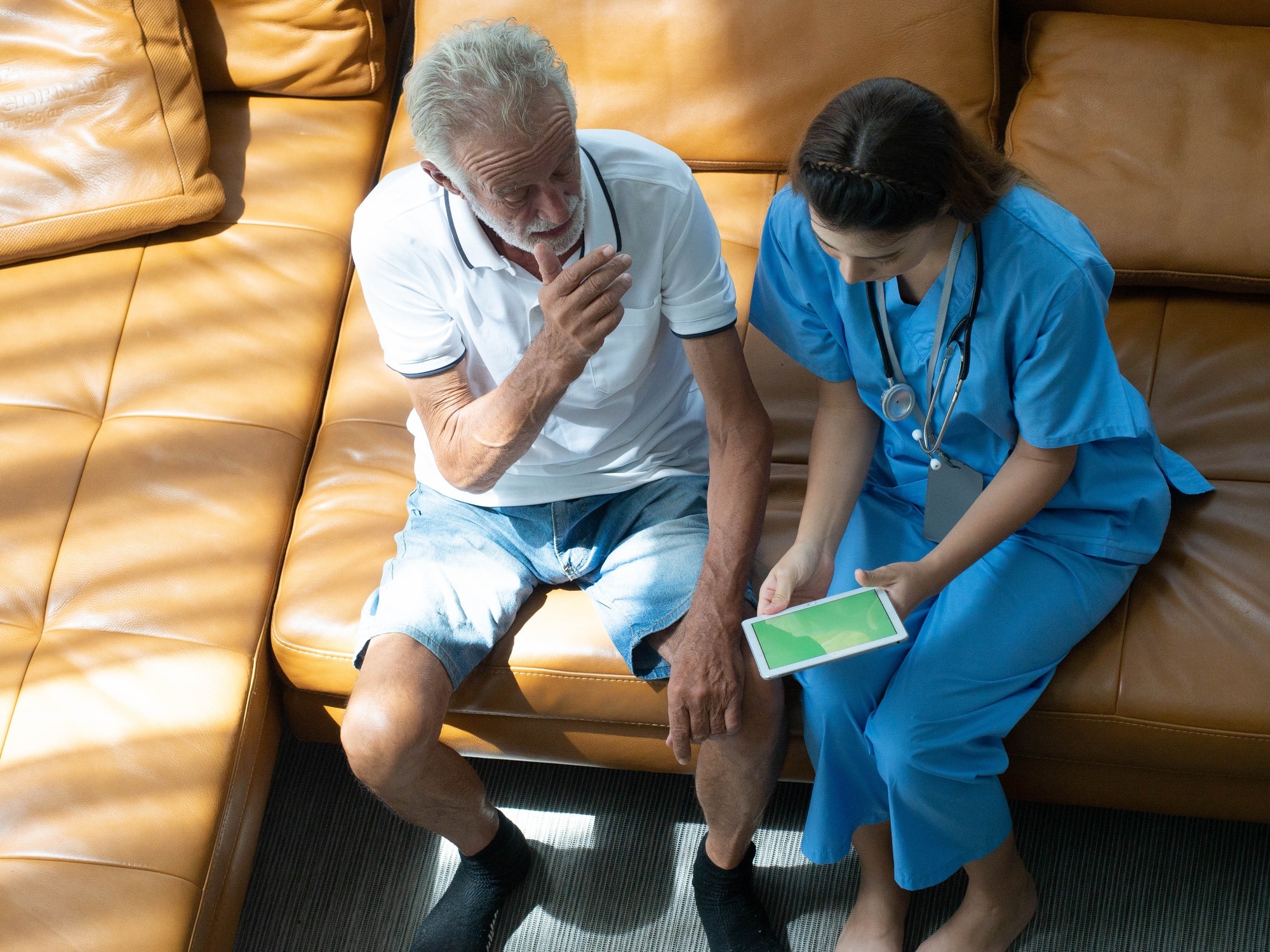 Doctor nurse female woman health care treatment patient male elderly senior hospital living room